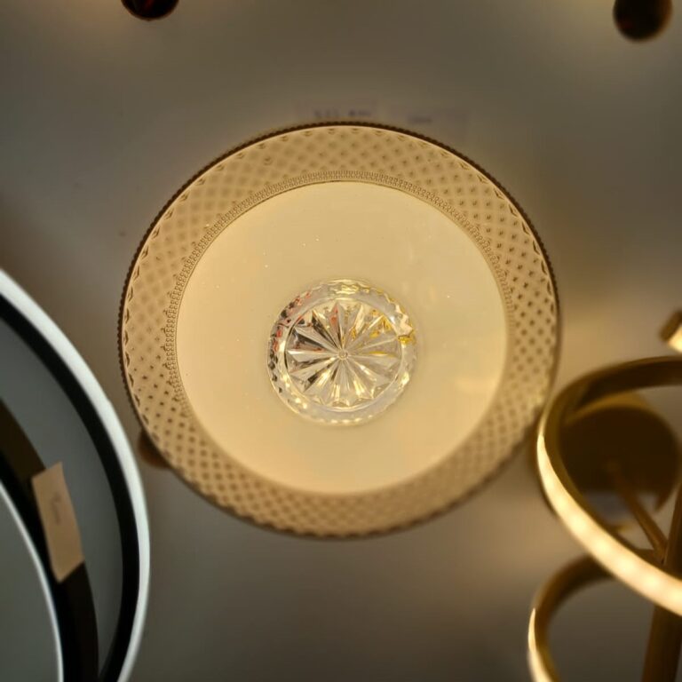 Golden Bloom Ceiling Light best prices in Nairobi Kenya A luxurious flush-mount ceiling light featuring a golden floral centerpiece and a detailed patterned border with a soft golden glow. Its elegant circular design brings warmth and sophistication, making it perfect for both modern and classic interiors.