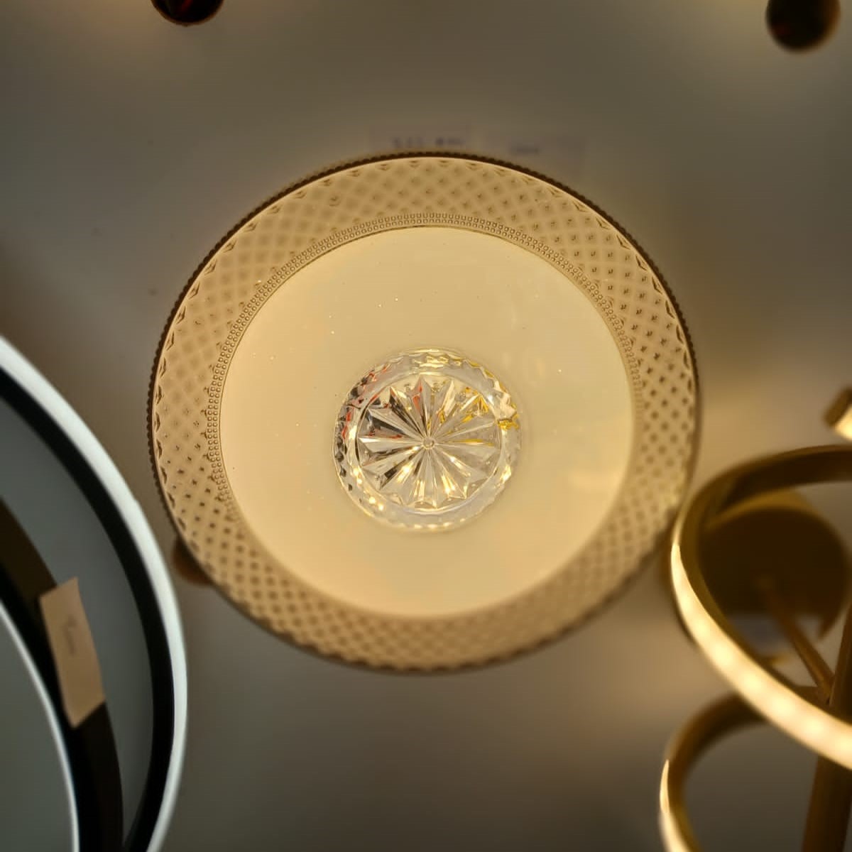 WhatsApp Image 2025-10-03 at 4.53.34 PM Golden Bloom Ceiling Light best prices in Nairobi Kenya A luxurious flush-mount ceiling light featuring a golden floral centerpiece and a detailed patterned border with a soft golden glow. Its elegant circular design brings warmth and sophistication, making it perfect for both modern and classic interiors.